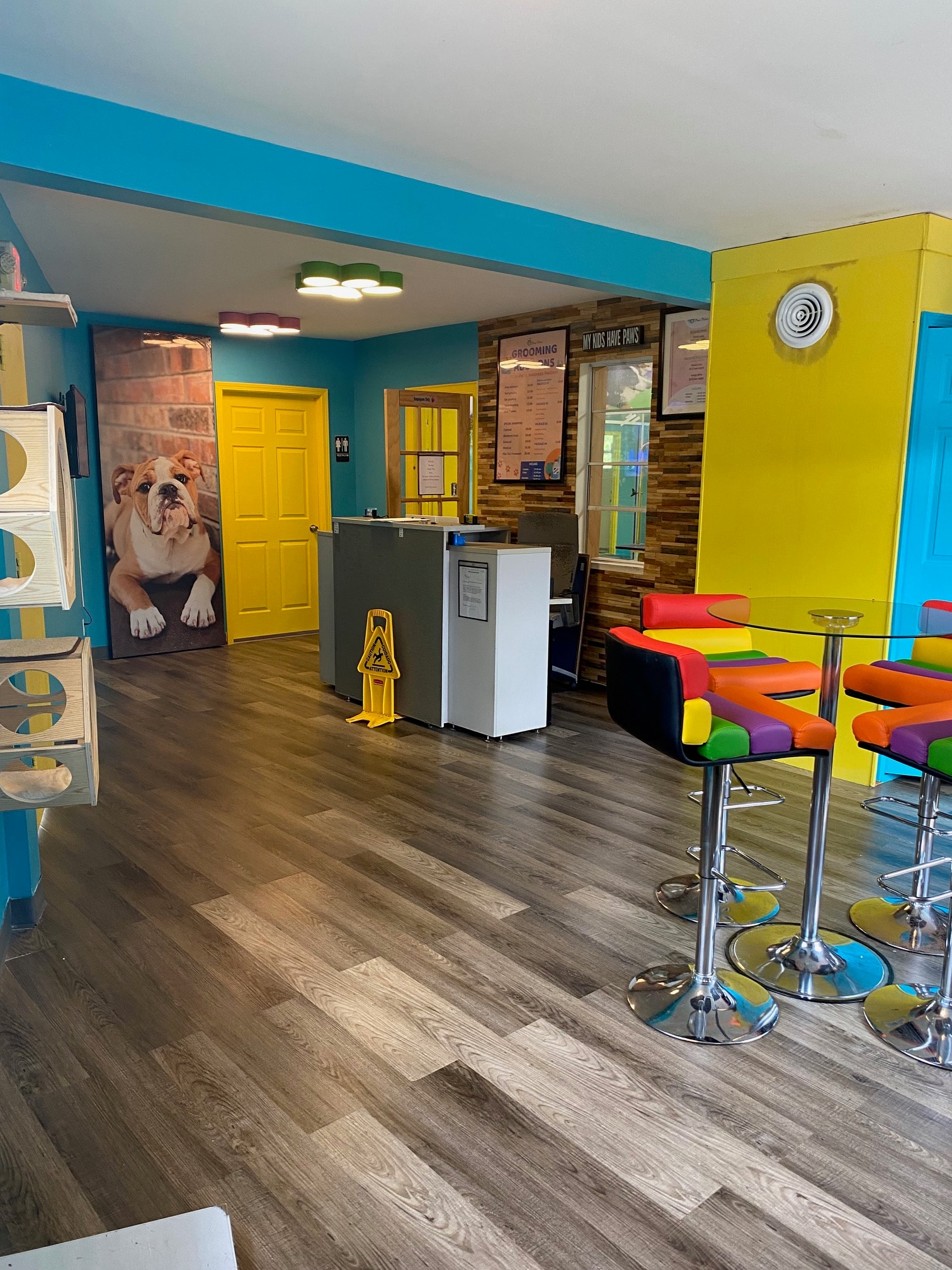 Professional pet groomer with a happy dog at Paw Palace of Atlanta